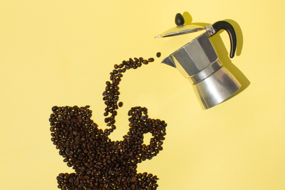 Pouring coffee from a moka pot and creating a coffee cup image with coffee beans